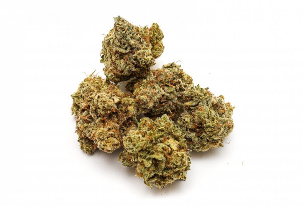 A close-up image of several cannabis buds for pre rolls. The buds are dense and covered in trichomes, giving them a frosted appearance. They display a mix of green and orange hues.